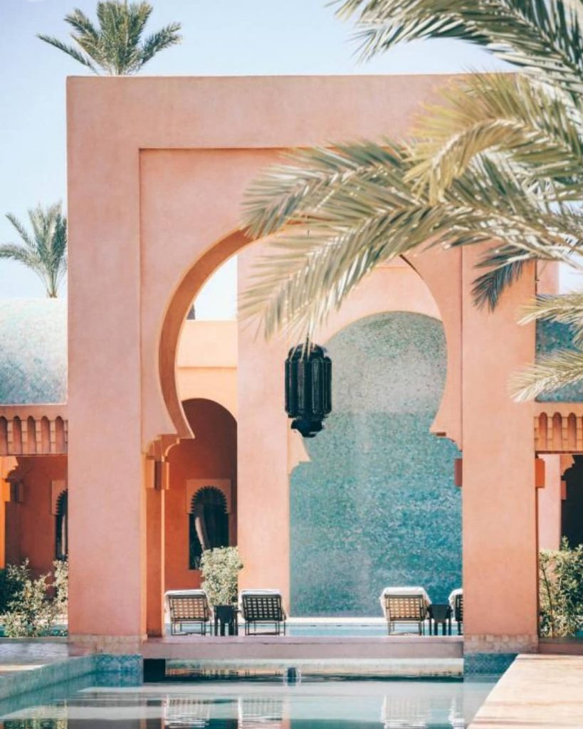 Perfectly peach walls with a plethora of palm and olive trees surround the grounds…