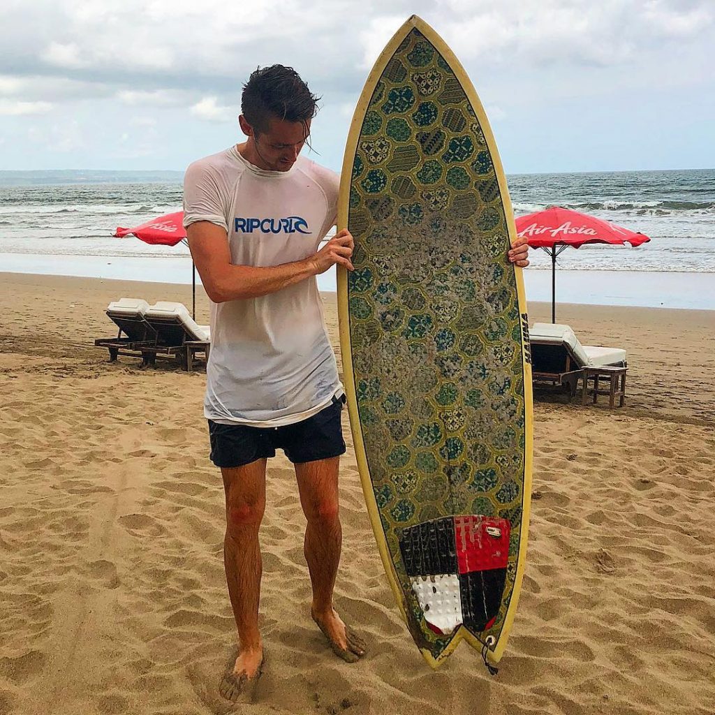 Surfing towards the spot where the sky meats the sea