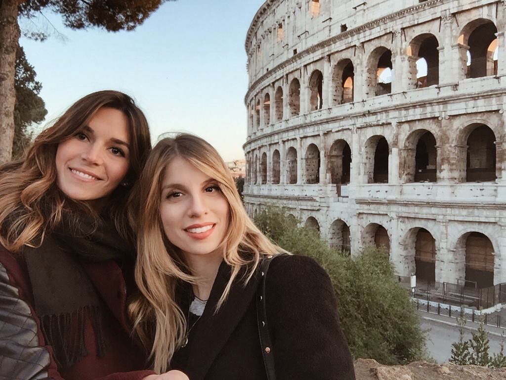 Giulia and Cristina with the Colosseum, on of the seven wonders of the world…