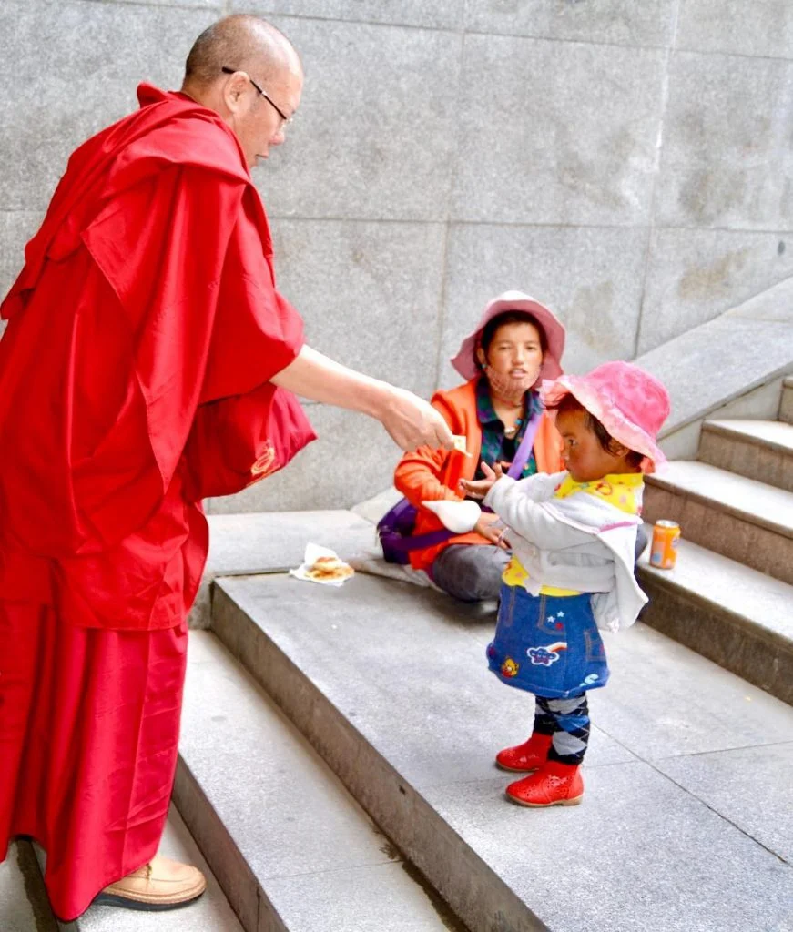 Charity to a child by a Tibetan Monk living up to the tenets of&hellip;