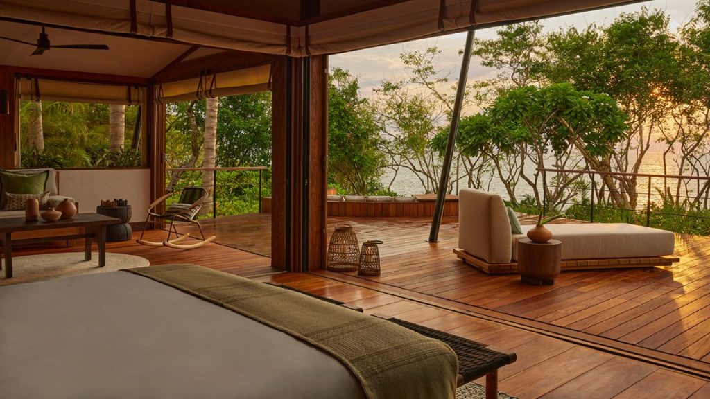 A serene beach scene featuring luxurious cabanas and palm trees, perfect for relaxation and enjoying the ocean view.