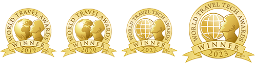 Image of the World Travel Award trophies for 2019, 2020, 2021, and 2023, showcasing four distinct shield designs.