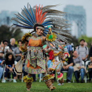 A vibrant scene from an Indigenous festival showcasing traditional celebrations and cultural expressions in a remote setting.