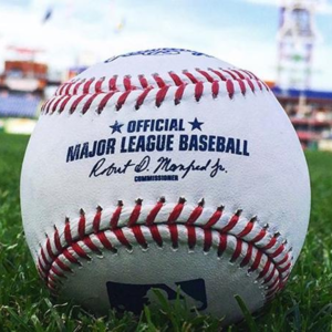 A travel guide cover for MLB Playoffs 2024, featuring a baseball field and fans celebrating in the stands.
