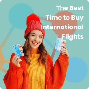 A woman excitedly holds her air tickets, symbolizing the best time to buy international flights.