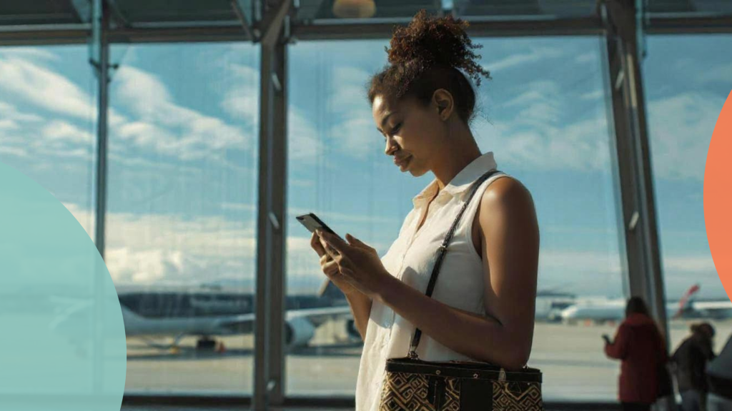 a women texting on whatsapp in the airport