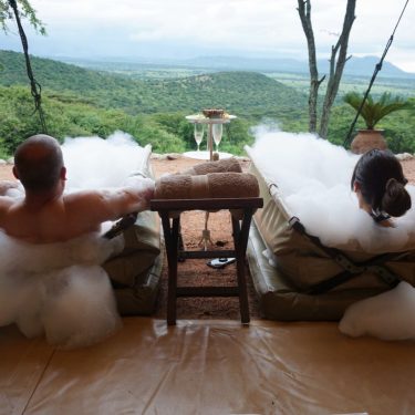 Basking with the love of my life in a traditional canvas bush bath overlooking…
