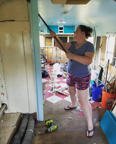 It’s gone! The wall is gone! We have wide open floors now and its…