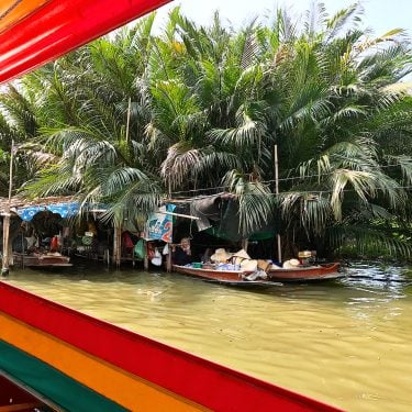 Taking a boat ride around the Bangkok canals and Floating Market