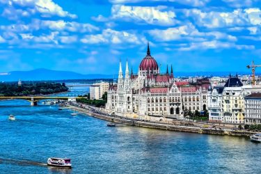 The Hungarian Parliament Building, also known as the Parliament of Budapest after its location,…