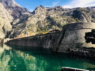 The fort walls and the clear waters of Montenegro #montenegro #exploretheworld #balkan #balkans #balkanislands…