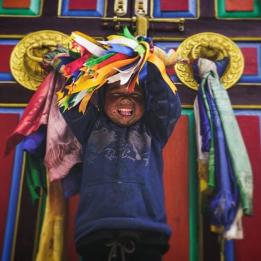 I found this little boy in a Tibetan temple near a small village en…