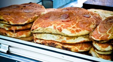 “Sfincionello” looks like pizza, but it isn’t. Looks like bread, but it isn’t. “Sfincionello”&hellip;