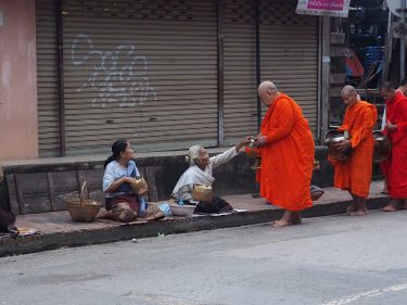 Tak Bat ceremony in Luang Prabang : monks’ morning collection of food. . .…