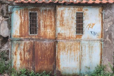 One of the old weathered gates we came by in Ohrid city. It…