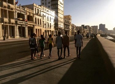 Strolling the Malecon at sunset. Read about our travels to Havana at . .&hellip;