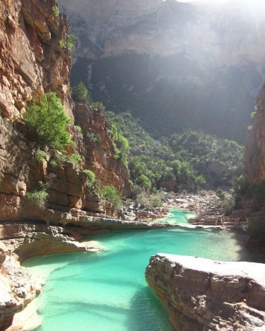When you are surrounded by limestone walls, palm tree-filled gorges and hear the faint…