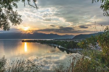 A beautiful sunset sets over Struga, as shot from a vantage point in…