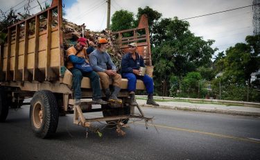 Cuban commute. This kind of thing was super common. Workers loaded up in open…